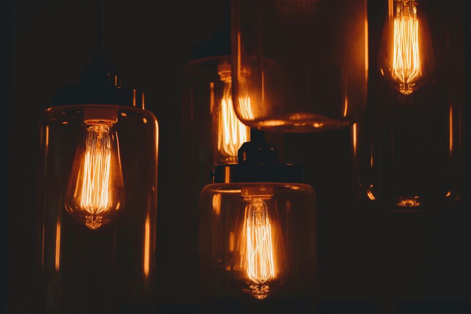 Philips Hue smart bulb illuminating a lamp
