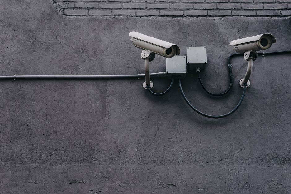 Outdoor security camera mounted on a house