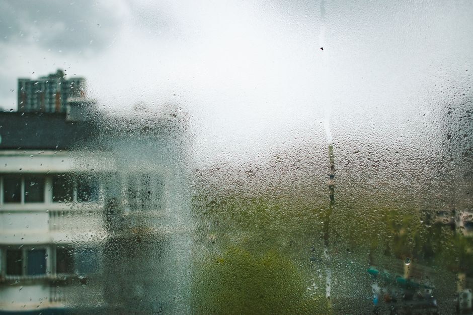 A smart dehumidifier running in a UK living room