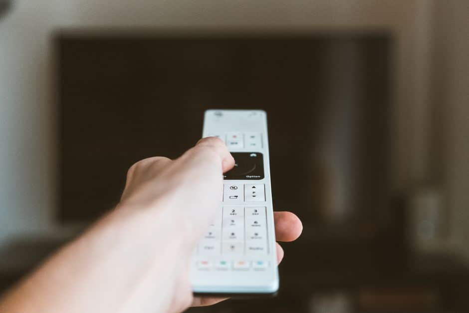 A streaming device plugged into a TV in a smart living room