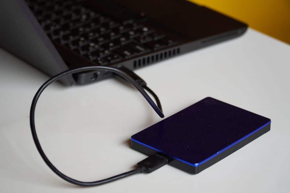 An external hard drive connected to a laptop for backups